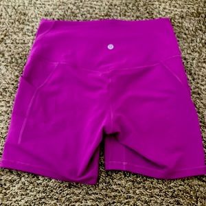 Lululemon vivid plum biker shorts.  High rise short with pockets.